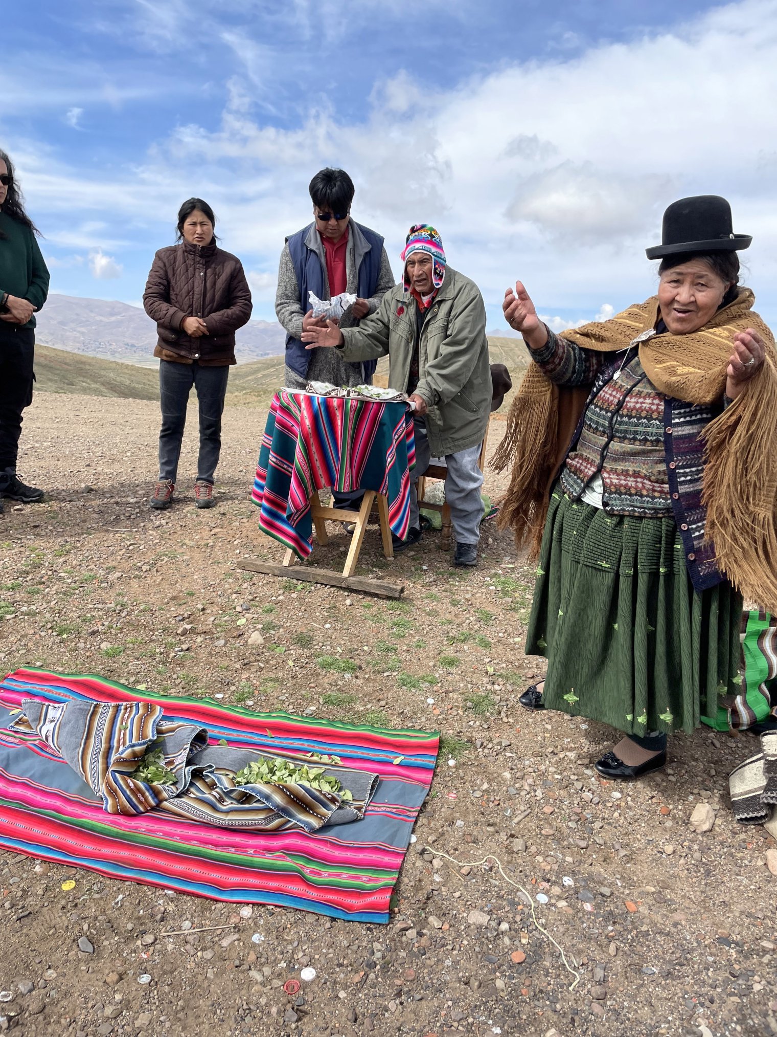 A group of people performing a sacred ritual on Lloco Lloco Mountain