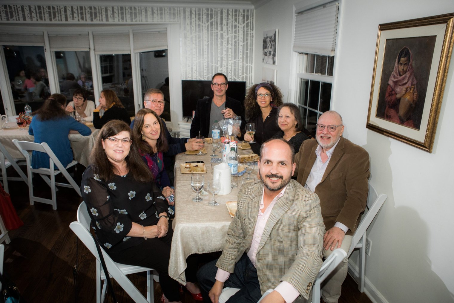 A group of people sit around a table after a meal