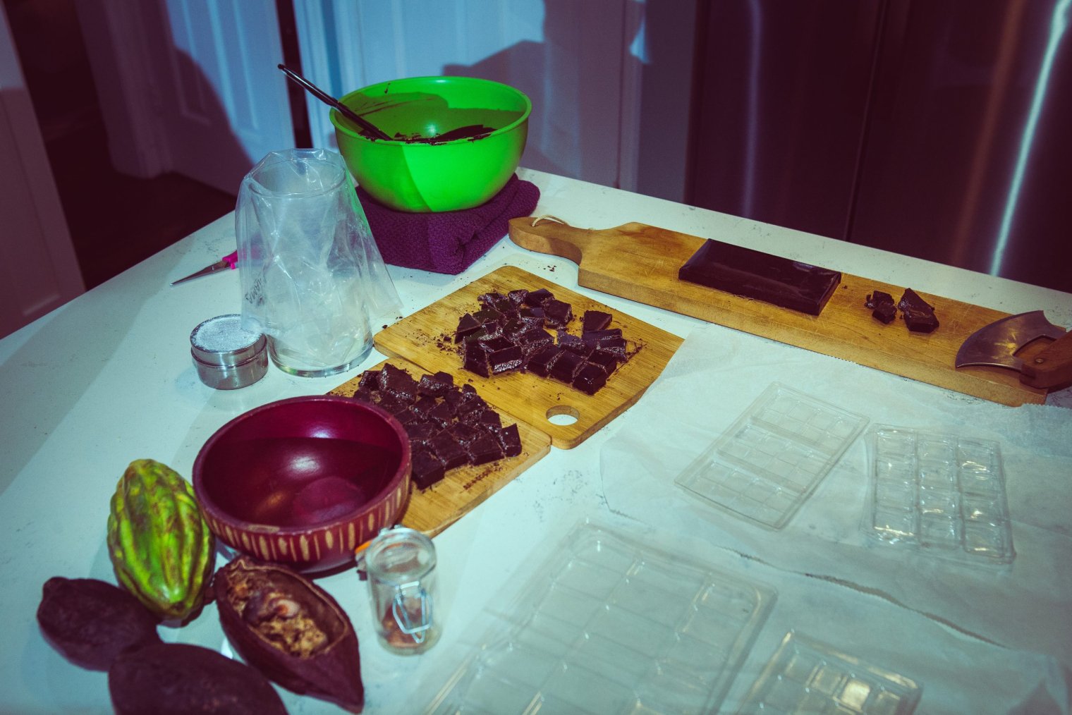 A collection of cutting boards with chocolate bars on top of them  
