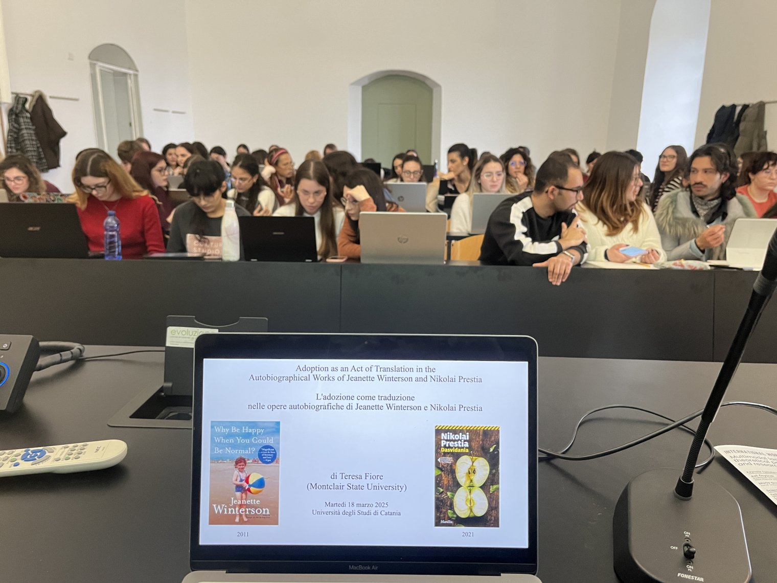 View from a presentation table looking onto an audience of college students