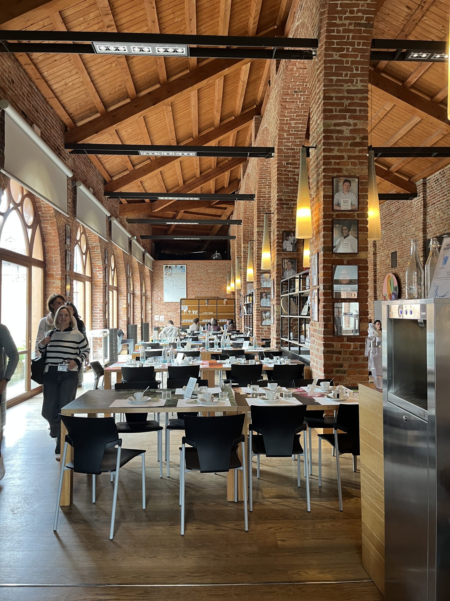 a dining room with high, wooden ceilings