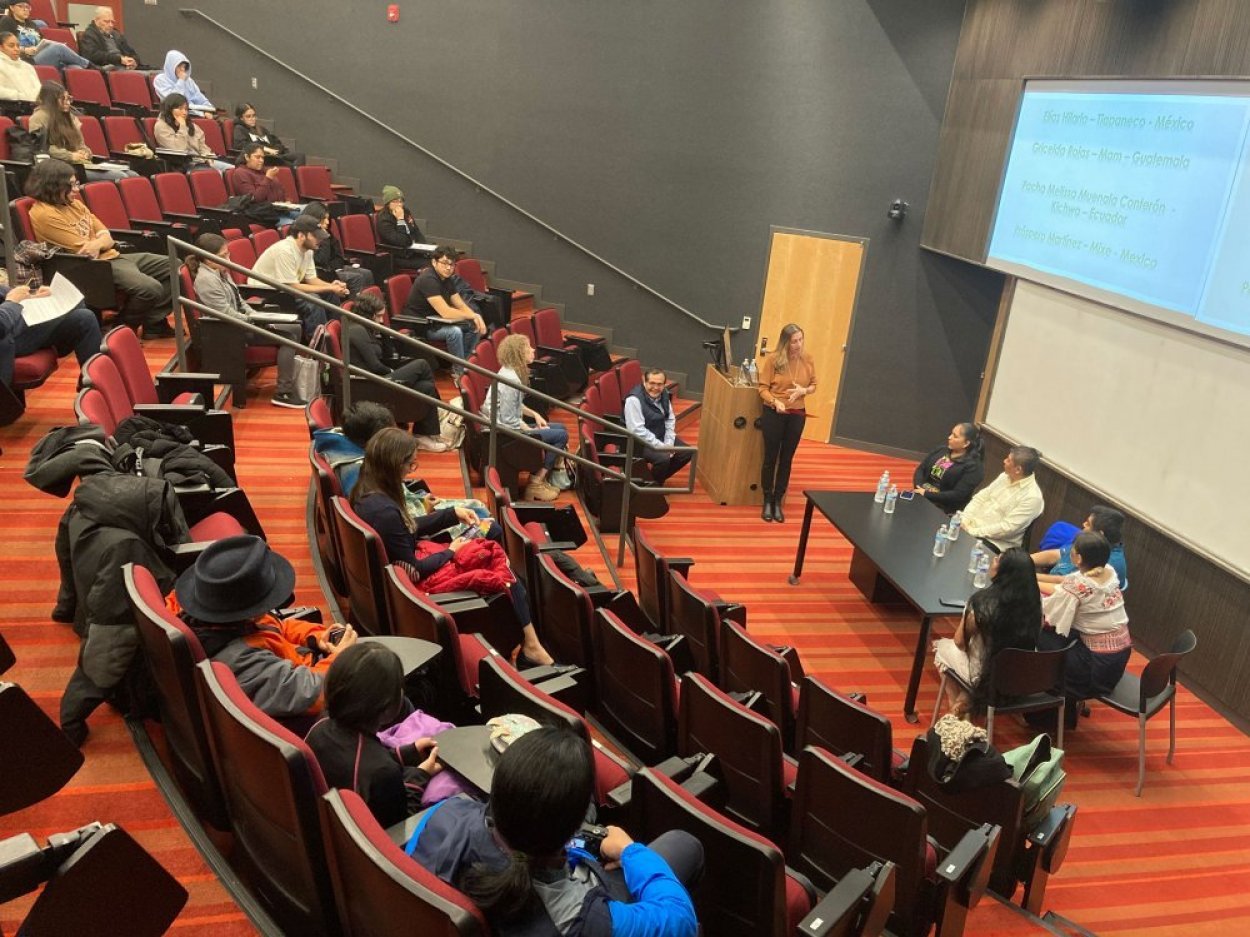 Interior of a college auditorium occupied by students and faculty