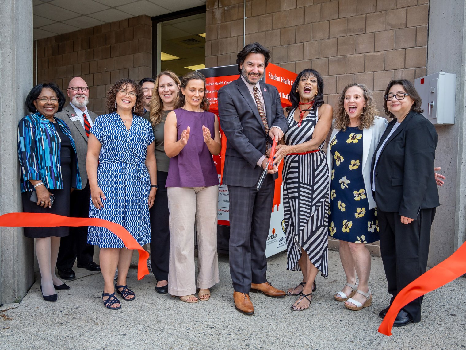 Montclair State University and Montclair Township officials celebrate delivery of the Harm Reduction Kiosk with a ribbon-cutting ceremony.