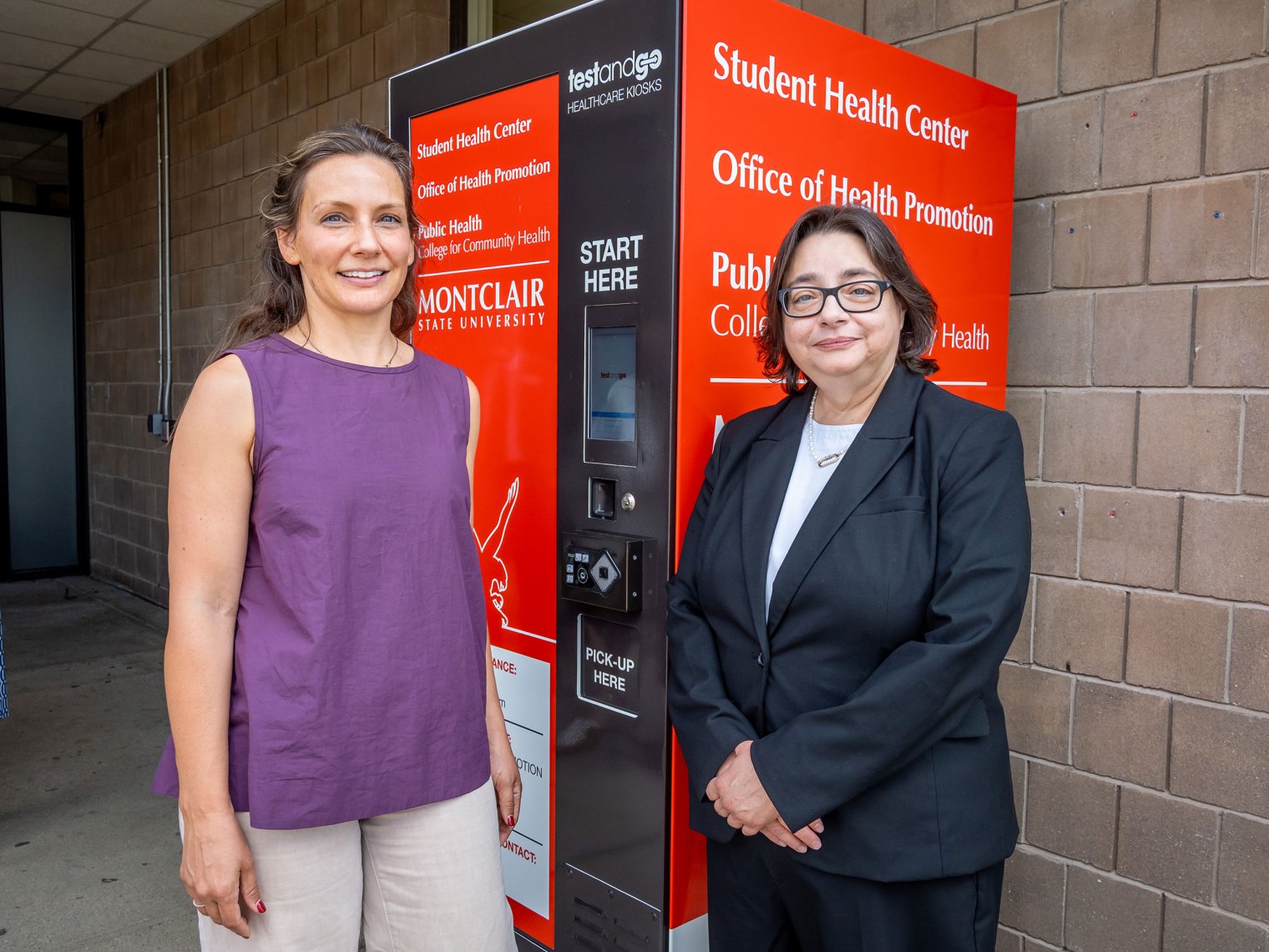 Student Health Center Director Sarah Jennings and Montclair Township’s Health Director Amy Monaco stand in front of the kiosk they helped design.