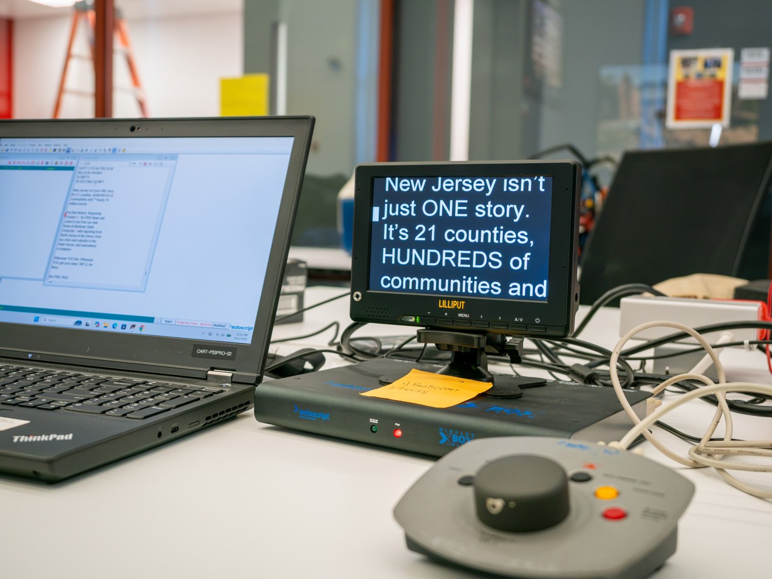 Text for PBS promo displayed in monitor. Text says: New Jersey isn't one story. It's 21 counties, hundreds of communities.