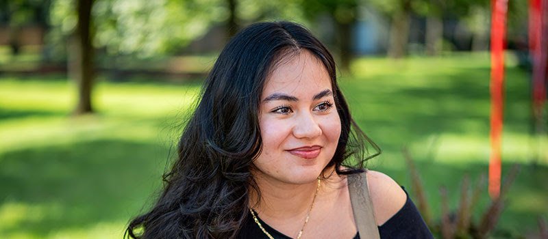 Montclair student enjoys beautiful weather on campus.