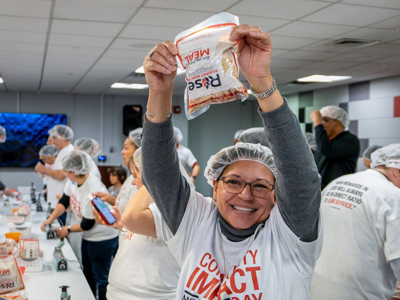 Iris V. DiMaio holds up a bag of a rice and soy mixture.