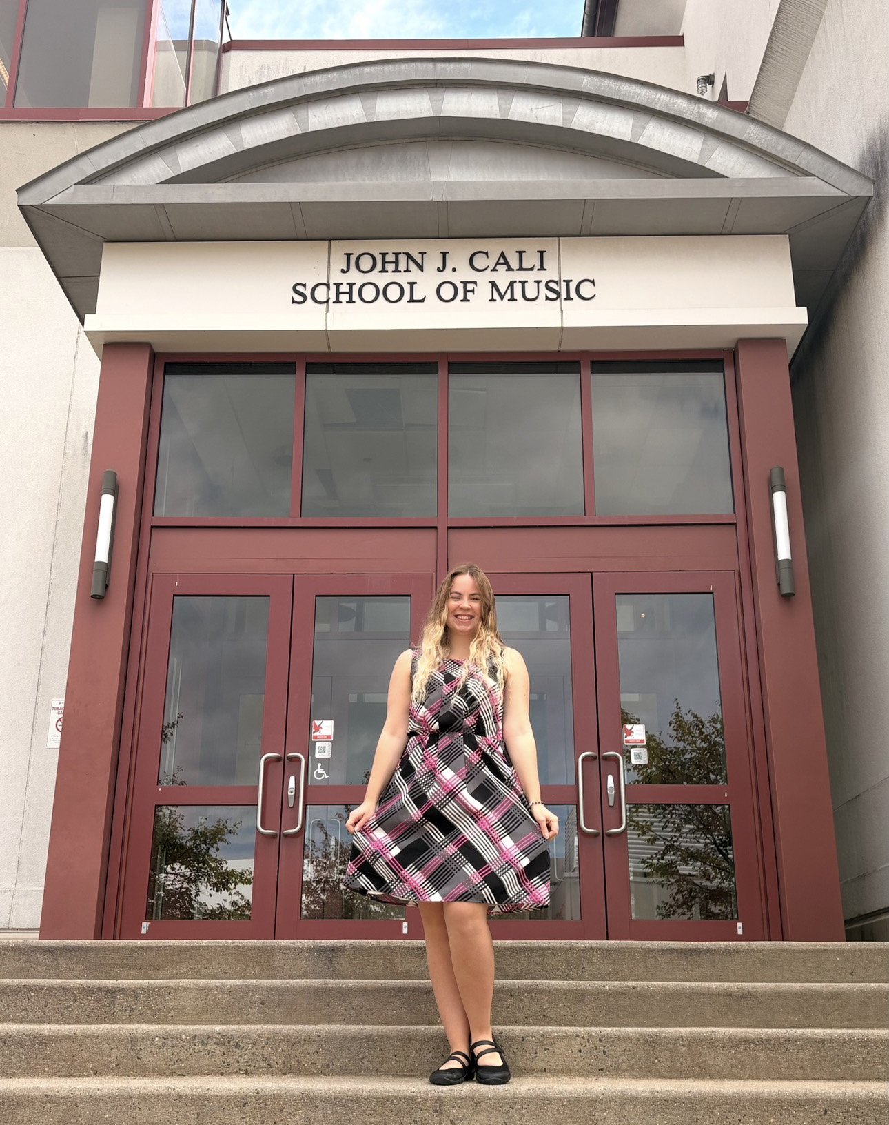 Evita on steps of Cali School of Music