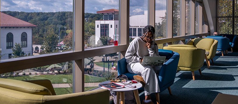 Graduate student studies on campus.