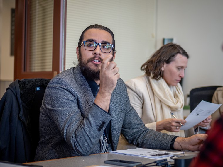 a man talks at a roundtable discussion