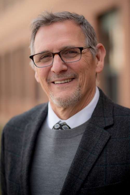 Headshot of Bryan Murdock with Black Blazer on. 