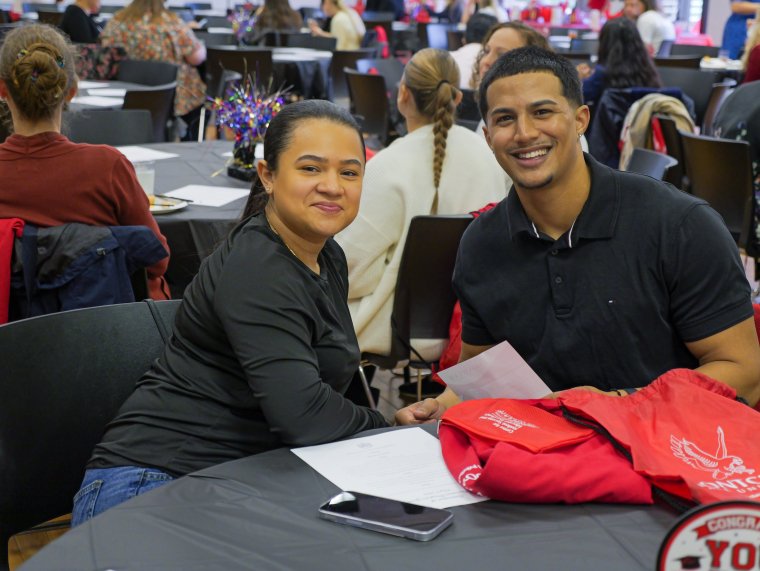two students attend the celebration