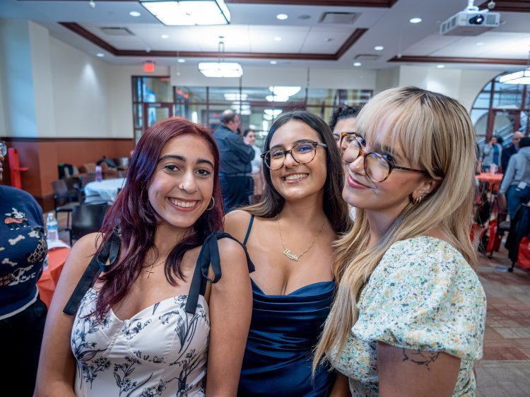 Rita Simoes, Tania Ferreira, and Bruna Demetrio pose for a picture