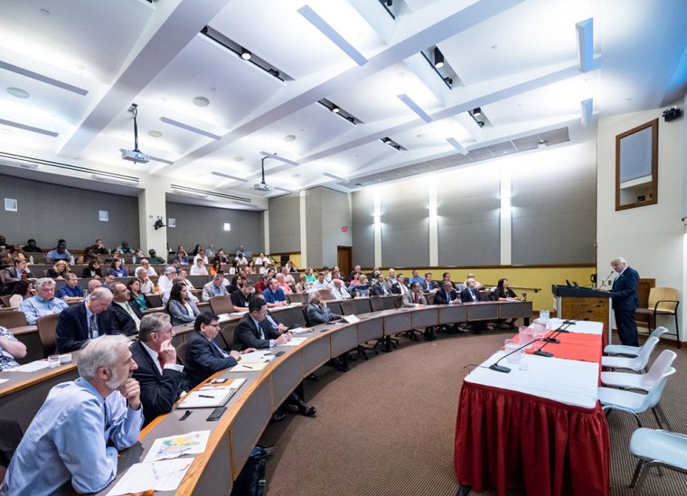 people in the conference center breakout room