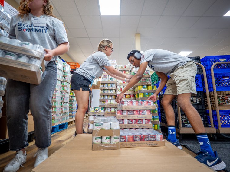 students volunteering at food pantry