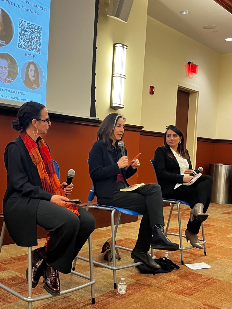 Three people present during a panel-style interview